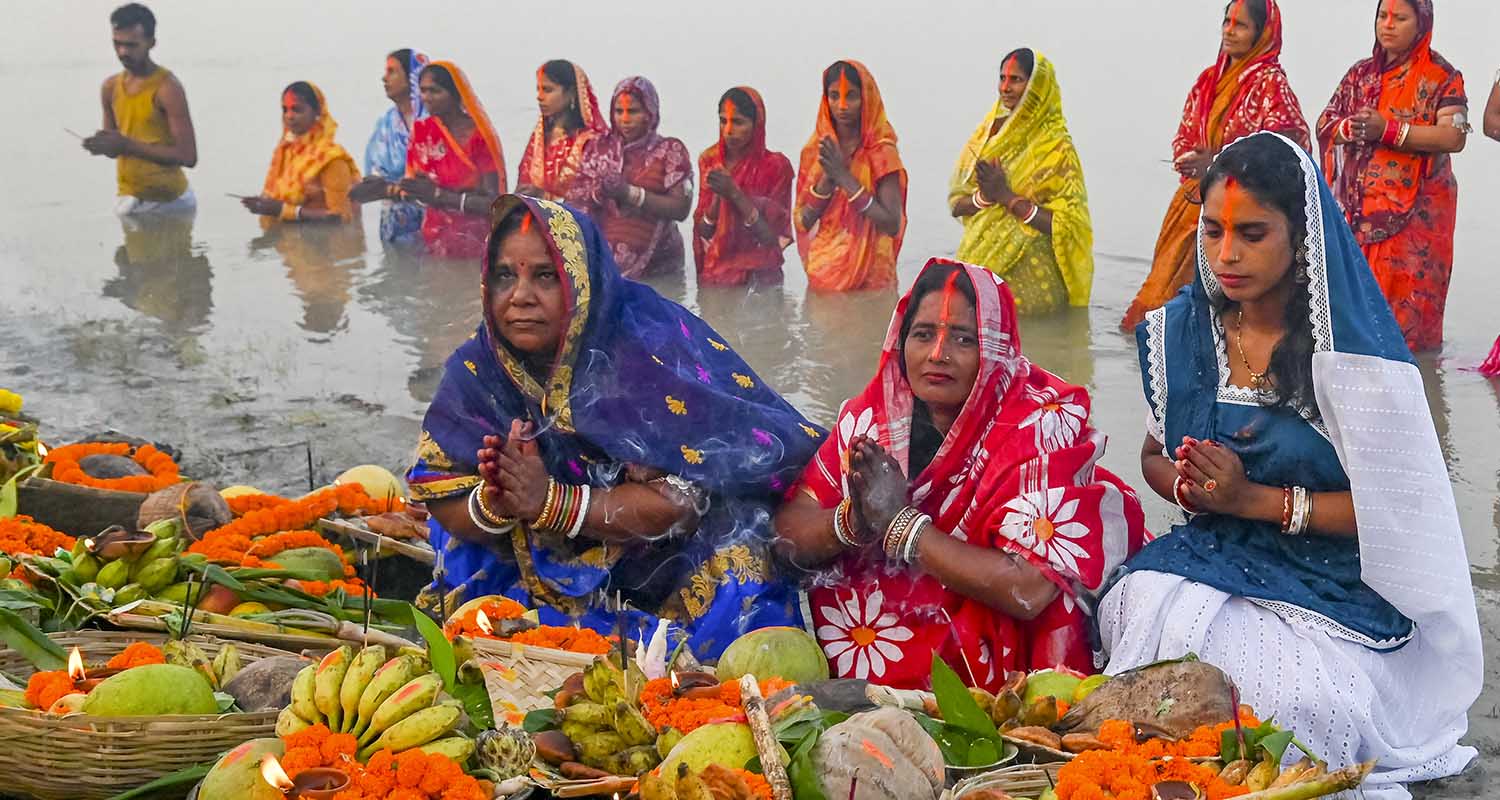 Women perform rituals during 'Chaiti chhath puja' festival, on the bank of the Hooghly river in Nadia, on Tuesday.