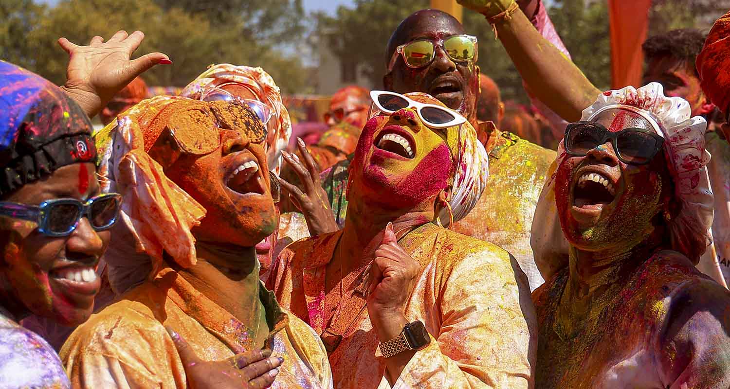 Artists dressed as Lord Krishna and Radha perform during a 'Holi Milan Samaroh' as part of the 'Holi' festival celebrations, in Patna, Bihar, on Tuesday.
