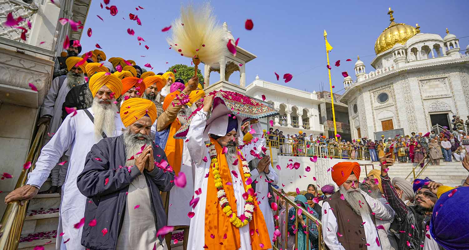 Members of the Sikh community take part in a ‘Nagar Kirtan’ procession commemorating the 350th anniversary of the martyrdom of the 9th Sikh Guru, Guru Tegh Bahadur, at Golden Temple in Amritsar, on Monday.