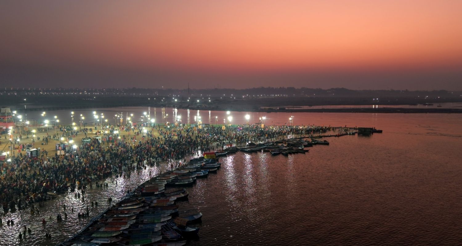 People take a holy dip at Sangam on the occasion of Maha Shivaratri, in Prayagraj.