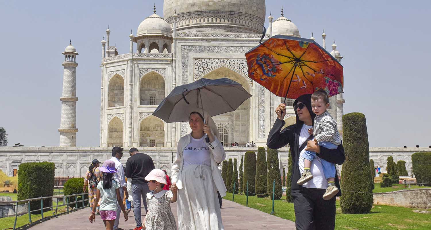 Tourists visit Taj Mahal on a hot summer day, in Prayagraj, Uttar Pradesh, on Tuesday.