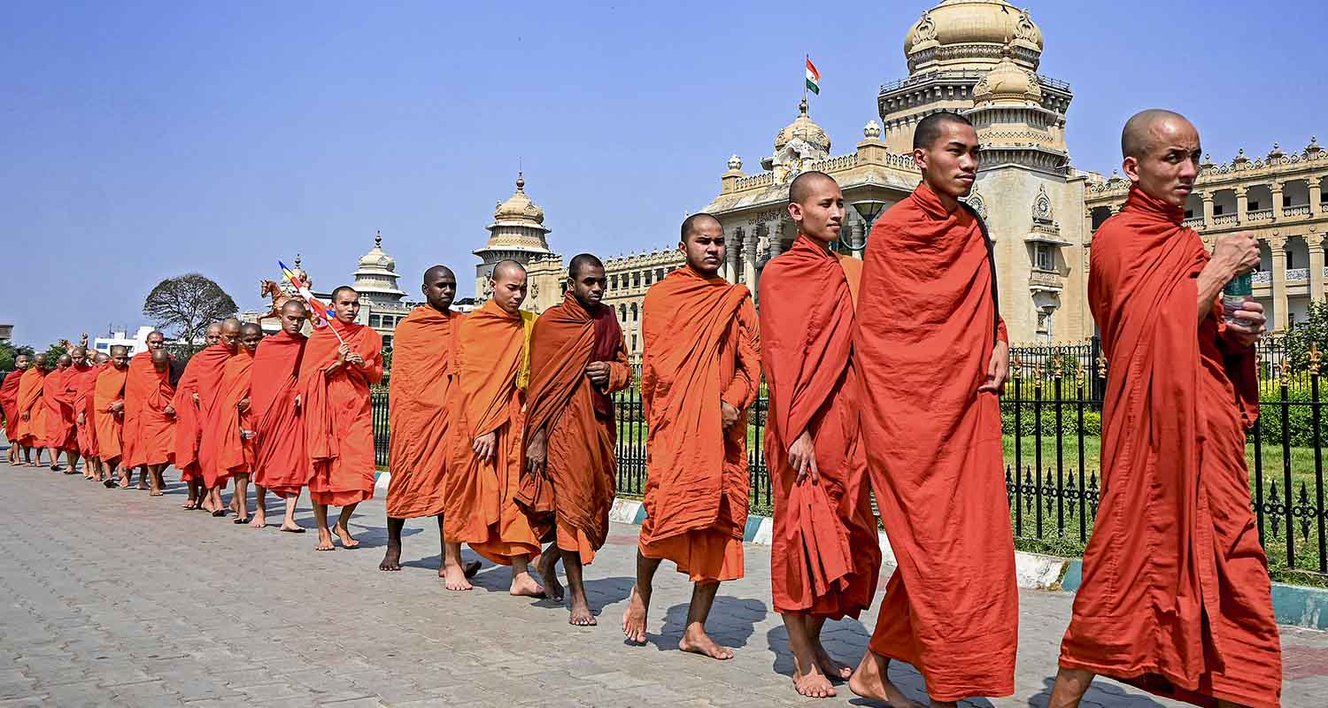 Monks from the Maha Bodhi Society take out a peace march, in Bengaluru, Karnataka, on Saturday.