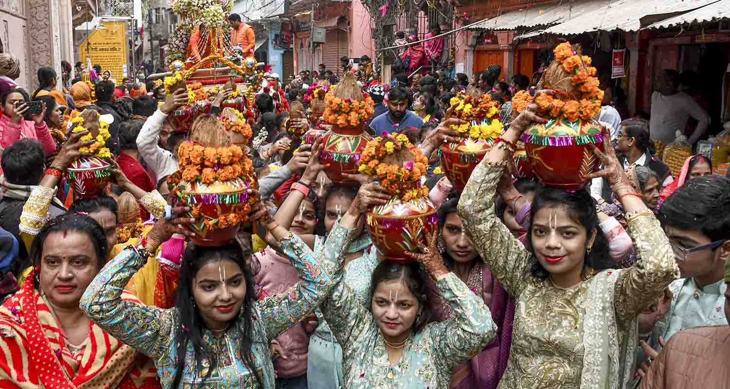 People take part in a religious procession on the occasion of ‘Paush Purnima’, marking the start of the ‘Magh Mela’ festival, in Prayagraj, on Saturday.