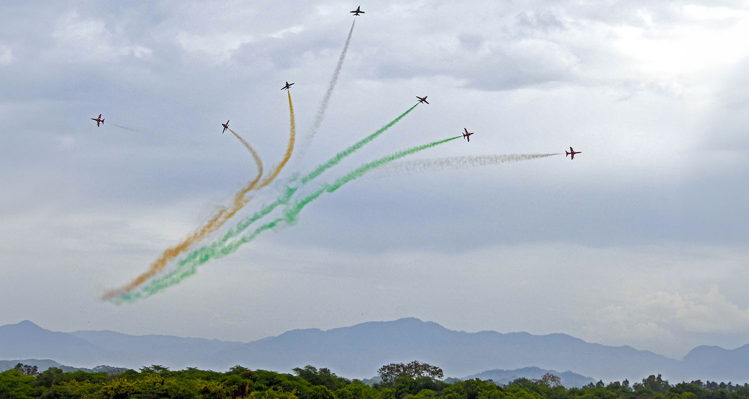 Indian Air Force's (IAF) Surya Kiran Aerobatic Team (SKAT) performs manoeuvres during an air show, near Sukhna Lake in Chandigarh, on Friday.