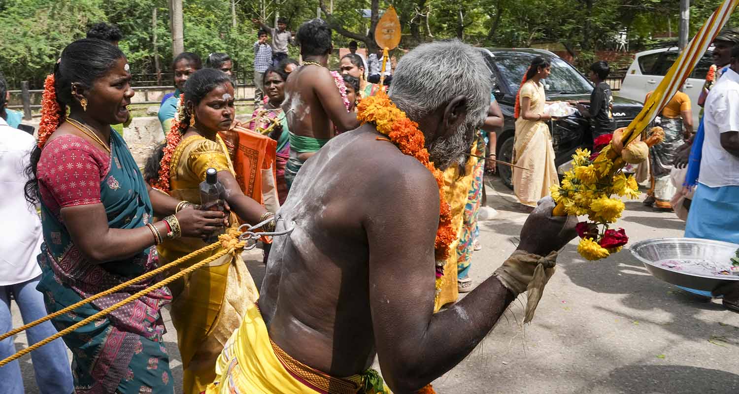A devotee with pierced back takes part in a procession on the Panguni Uthiram festival, honouring the Hindu God Murugan in the Tamil month of Panguni, in New Delhi, on Wednesday.