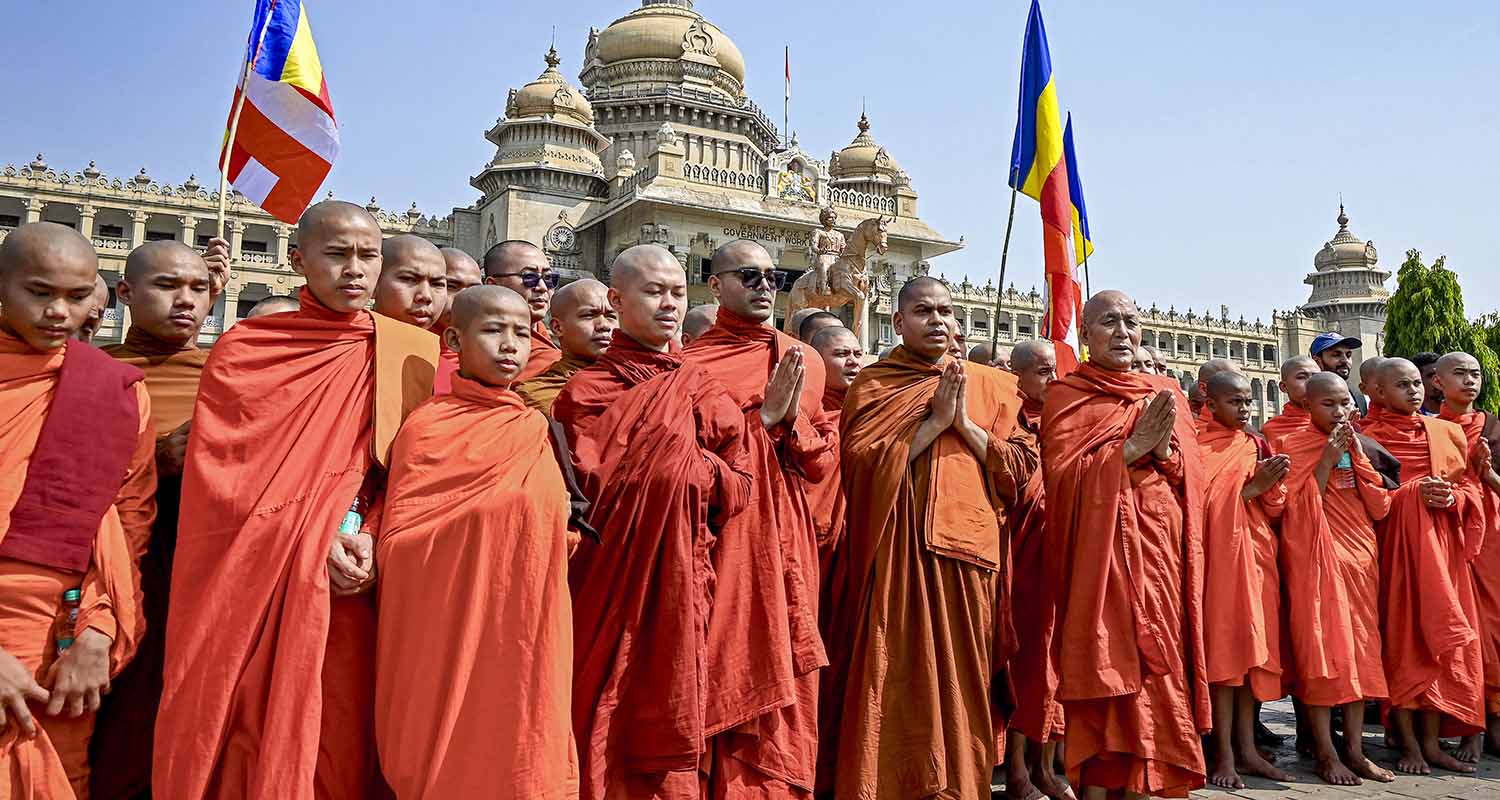 Monks from the Maha Bodhi Society take out a peace march, in Bengaluru, Karnataka, on Saturday.