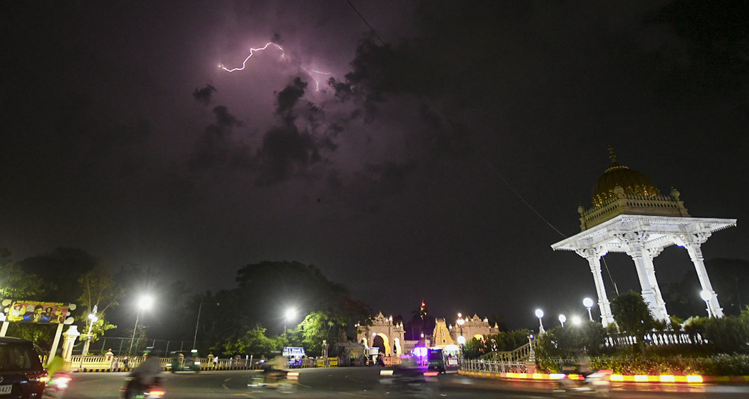 Lightning flashes across the night sky during a thunderstorm, in Mysuru, on Tuesday.