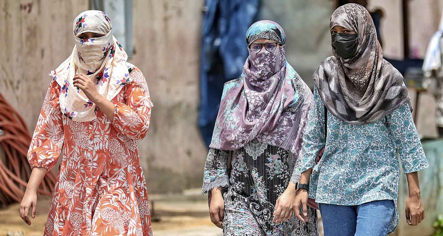 Women cover themselves on a hot summer day, in Jaipur, Rajasthan, on Tuesday.