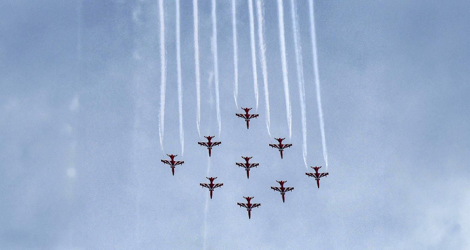 Indian Air Force's (IAF) Surya Kiran Aerobatic Team (SKAT) performs manoeuvres during an air show, near Sukhna Lake in Chandigarh, on Friday.