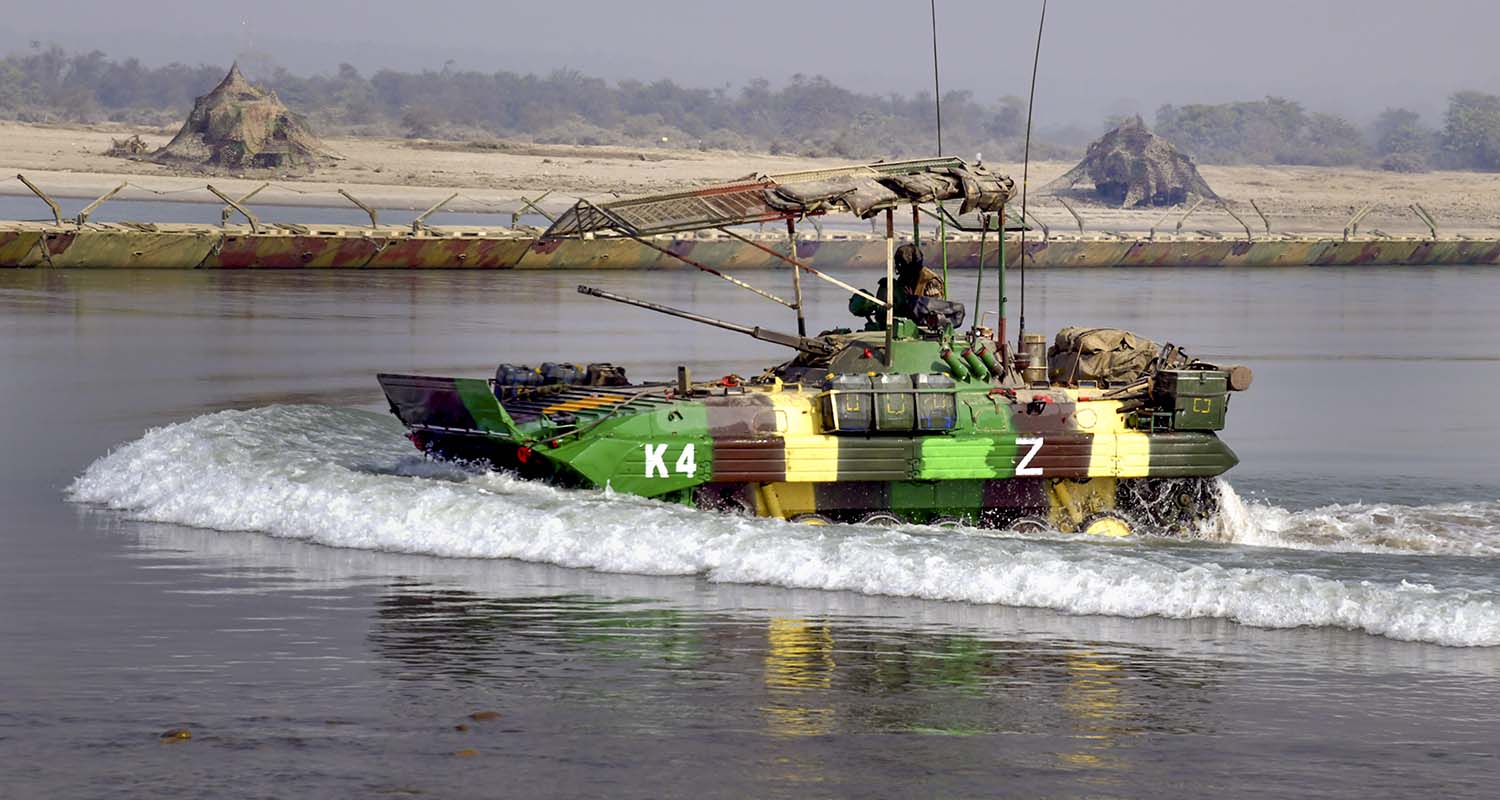 An Army personnel drives an amphibious armoured vehicle through a water body during exercise ‘Ram Prahar’ led by the Western Command at Jhilmil Lake Reserve Forest, in Haridwar, Uttarakhand, on Saturday.