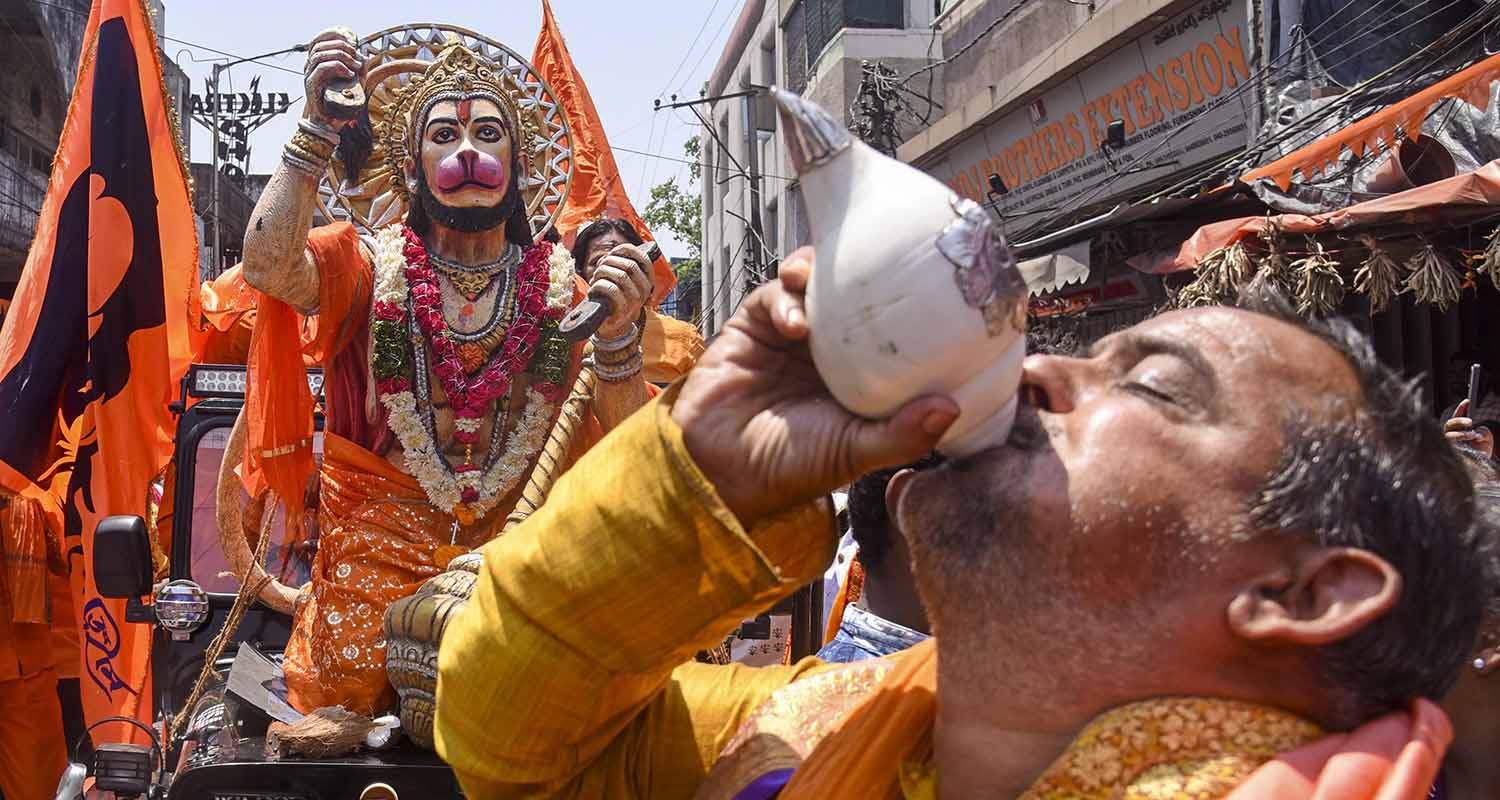 A devotee blows a conch during a religious procession from Gowliguda to Tadbund on the Hanuman Jayanti festival, in Hyderabad, on Thursday. A devotee blows a conch during a religious procession from Gowliguda to Tadbund on the Hanuman Jayanti festival, in Hyderabad, on Thursday.